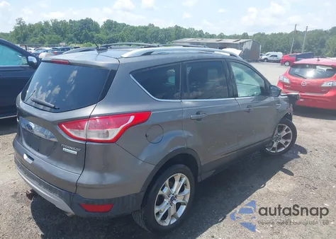 2014 Ford Escape Titanium z USA, uszkodzony, nr VIN 1FMCU0J9XEUC10891